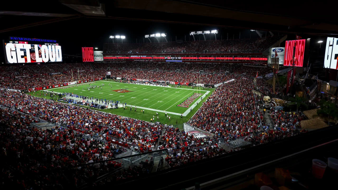 A packed Raymond James Stadium under the lights on game day